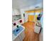 Functional kitchen with laminate flooring, bright yellow curtains, and ample counter space, ready for your personal touch at 4851 W Gandy Blvd # B7L36, Tampa, FL 33611