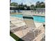 Inviting community pool area with lounge chairs for relaxing and enjoying the Florida sunshine at 4851 W Gandy Blvd # B7L36, Tampa, FL 33611