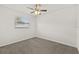 Empty bedroom featuring carpet and a window at 4945 91St N Ave # 30, Pinellas Park, FL 33782