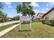 Breezeway Villas property sign in front of the complex and landscaping at 4945 91St N Ave # 30, Pinellas Park, FL 33782