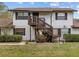 Charming two-story home with wooden staircase and well-maintained lawn at 4945 91St N Ave # 30, Pinellas Park, FL 33782
