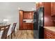 Kitchen with wood cabinets, granite countertops, and stainless steel appliances at 4945 91St N Ave # 30, Pinellas Park, FL 33782
