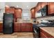 Cozy kitchen featuring granite countertops, and modern appliances at 4945 91St N Ave # 30, Pinellas Park, FL 33782