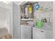 Cozy laundry space with washer and dryer; storage shelving at 4945 91St N Ave # 30, Pinellas Park, FL 33782