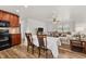 Open-concept living area featuring wood floors, a dining table, and a comfortable couch at 4945 91St N Ave # 30, Pinellas Park, FL 33782