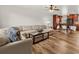 Open-concept living room flowing into the dining area with hardwood floors at 4945 91St N Ave # 30, Pinellas Park, FL 33782
