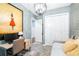 Cozy bedroom with a daybed, desk, wood accent wall, and modern light fixture at 511 Winterside Dr, Apollo Beach, FL 33572