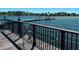 Scenic dock view featuring a wooden deck and metal railing overlooking tranquil water at 511 Winterside Dr, Apollo Beach, FL 33572