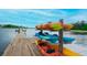 Kayaks on a wooden dock offering a vibrant waterside recreational experience at 511 Winterside Dr, Apollo Beach, FL 33572