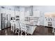 Bright, modern kitchen with stainless steel appliances, a large island, and stylish pendant lighting above the breakfast bar at 511 Winterside Dr, Apollo Beach, FL 33572