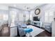 Inviting living room with a comfortable sofa, plantation shutters, and stylish decor, perfect for relaxing and entertaining at 511 Winterside Dr, Apollo Beach, FL 33572