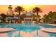 Beautiful resort style pool with a water slide, spacious decks, and a stunning sunset backdrop at 511 Winterside Dr, Apollo Beach, FL 33572