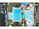 Aerial view of a resort style pool area with lap pool, freeform pool, and palm trees at 511 Winterside Dr, Apollo Beach, FL 33572