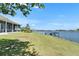 Backyard view of waterfront property with a private boat dock at 5205 Brighton Shore Dr, Apollo Beach, FL 33572