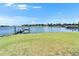 Backyard view of waterfront property with a private boat dock at 5205 Brighton Shore Dr, Apollo Beach, FL 33572