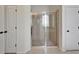 Modern bathroom features a glass shower and two large closets at 5205 Brighton Shore Dr, Apollo Beach, FL 33572