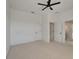 Spacious bedroom features neutral carpet, ceiling fan, and two closets at 5205 Brighton Shore Dr, Apollo Beach, FL 33572