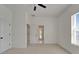 Bright bedroom features a ceiling fan and access to an ensuite bathroom at 5205 Brighton Shore Dr, Apollo Beach, FL 33572