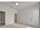 Neutral-toned bedroom featuring two doors, carpeted floors, and an attached bathroom at 5205 Brighton Shore Dr, Apollo Beach, FL 33572