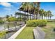 Community boat lift, with access to waterfront views and amenities, bench nearby at 5205 Brighton Shore Dr, Apollo Beach, FL 33572