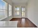 Dining area with hardwood floors offers a view of the lake at 5205 Brighton Shore Dr, Apollo Beach, FL 33572
