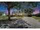Beautiful home with mature tree, well-manicured lawn, and a two-car garage at 5205 Brighton Shore Dr, Apollo Beach, FL 33572