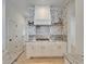 Gas stove with custom wallpaper in the background of the updated kitchen with marble countertops at 5205 Brighton Shore Dr, Apollo Beach, FL 33572