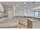 Updated kitchen featuring white cabinets, stainless steel appliances, and a marble countertop with tiled floor at 5205 Brighton Shore Dr, Apollo Beach, FL 33572
