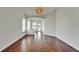 Open-concept living area with hardwood floors and plenty of natural light at 5205 Brighton Shore Dr, Apollo Beach, FL 33572