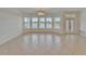 Bright living room with tile flooring and multiple windows offering water views at 5205 Brighton Shore Dr, Apollo Beach, FL 33572