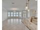 Spacious living room with tiled floor, lots of natural light, and water views at 5205 Brighton Shore Dr, Apollo Beach, FL 33572