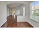 Sun-filled living room featuring hardwood floors and an open floor plan at 5205 Brighton Shore Dr, Apollo Beach, FL 33572