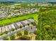 This aerial view reveals a neighborhood surrounded by natural beauty, including green spaces and waterways at 5410 River Sound Ter, Bradenton, FL 34208