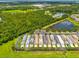 The aerial view shows a well-planned community with a mix of homes, ponds, and natural wooded areas at 5410 River Sound Ter, Bradenton, FL 34208