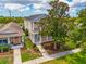 Aerial view of the two-story home with a charming front yard and a cozy neighborhood setting at 5410 River Sound Ter, Bradenton, FL 34208