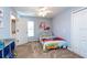 Bedroom featuring blue walls, closet, ceiling fan, and cartoon fire truck decor at 5410 River Sound Ter, Bradenton, FL 34208