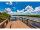 Community dock on the water under a beautiful blue sky at 5410 River Sound Ter, Bradenton, FL 34208