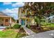 Charming two-story home with a colorful front door, columns, and nicely landscaped front yard at 5410 River Sound Ter, Bradenton, FL 34208