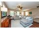 Comfortable living room featuring a sectional sofa, modern decor, and natural light at 5410 River Sound Ter, Bradenton, FL 34208