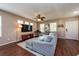 Bright living room with comfortable seating, a ceiling fan, and a large window that allows ample natural light at 5410 River Sound Ter, Bradenton, FL 34208