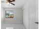 Bedroom with natural light, a ceiling fan, and a large closet at 6370 Elmhurst Dr, Pinellas Park, FL 33782