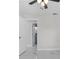 Empty bedroom with a door leading to a bathroom and a window letting in natural light at 6370 Elmhurst Dr, Pinellas Park, FL 33782