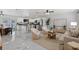 Spacious living room with an open-concept design that showcases a kitchen and dining area at 6370 Elmhurst Dr, Pinellas Park, FL 33782