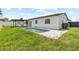 Featuring a long, rectangular in-ground pool and a shaded seating area at 6370 Elmhurst Dr, Pinellas Park, FL 33782