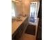 Double sink bathroom featuring modern vanity and tile floor at 6403 Elliot Dr, Tampa, FL 33615