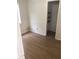 Bright bedroom with wood floors, natural light, and a closet for storage at 6403 Elliot Dr, Tampa, FL 33615