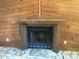 Close up view of the fireplace with wood mantel at 6403 Elliot Dr, Tampa, FL 33615