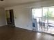 Spacious living room with sliding glass doors leading to a wooden deck at 6403 Elliot Dr, Tampa, FL 33615
