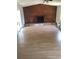 Spacious living room with hardwood floors and fireplace at 6403 Elliot Dr, Tampa, FL 33615