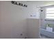 Bathroom featuring a tub with shower, light fixture, and a neutral color palette at 6925-A Avenue Des Palais # 1A, South Pasadena, FL 33707